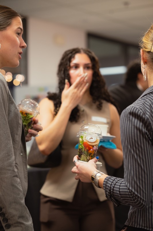 Guests chatting with salads
